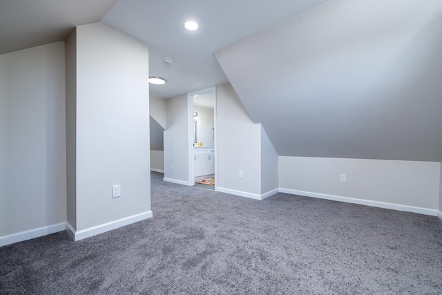 bonus room featuring lofted ceiling, carpet flooring, recessed lighting, and baseboards