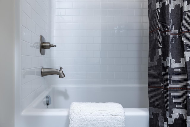 bathroom with shower / bath combo
