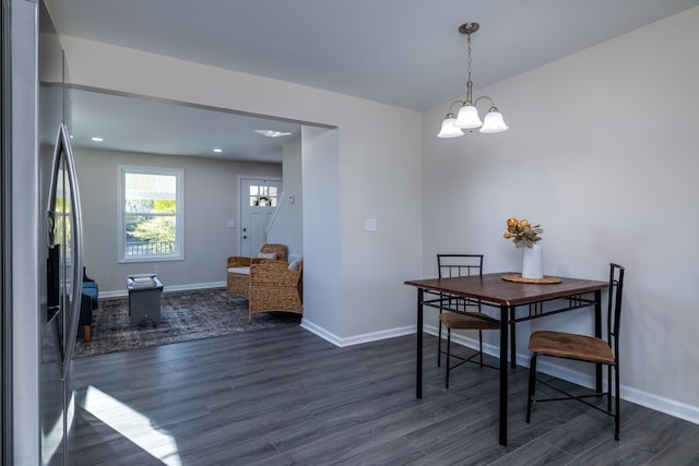 dining area with an inviting chandelier, recessed lighting, baseboards, and dark wood finished floors