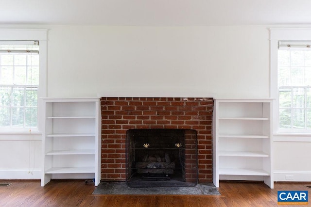 2201 Stadium Rd, Charlottesville, VA 22903 - detailed view of wood finished floors and a brick fireplace