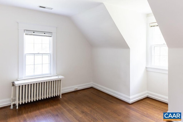 2201 Stadium Rd, Charlottesville, VA 22903 - bonus room with radiator, wood finished floors, plenty of natural light, and vaulted ceiling