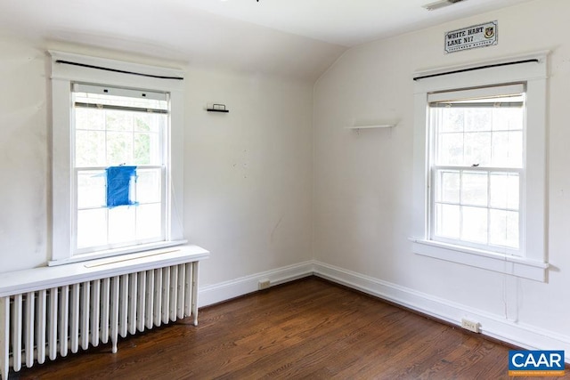 2201 Stadium Rd, Charlottesville, VA 22903 - spare room with radiator, dark wood-type flooring, and lofted ceiling
