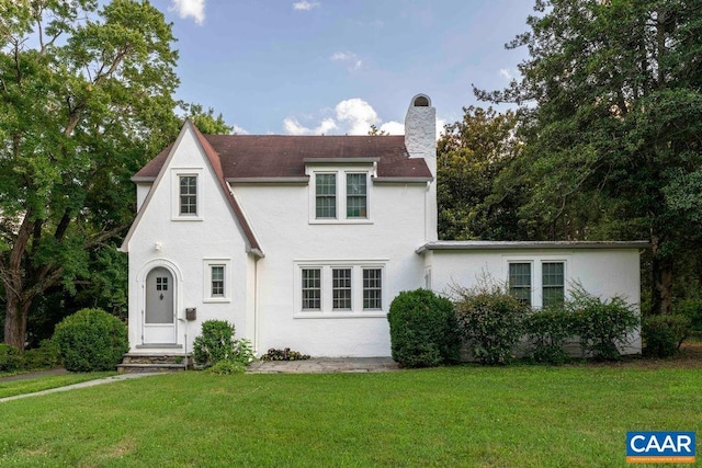 2201 Stadium Rd, Charlottesville, VA 22903 - view of front facade with a front lawn, a chimney, and stucco siding