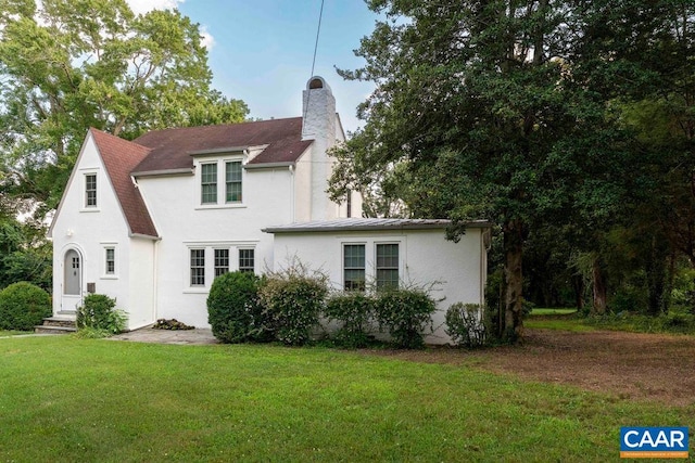 2201 Stadium Rd, Charlottesville, VA 22903 - view of front of property featuring a front yard, stucco siding, and a chimney
