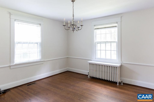 2201 Stadium Rd, Charlottesville, VA 22903 - empty room with a chandelier, radiator heating unit, and wood finished floors