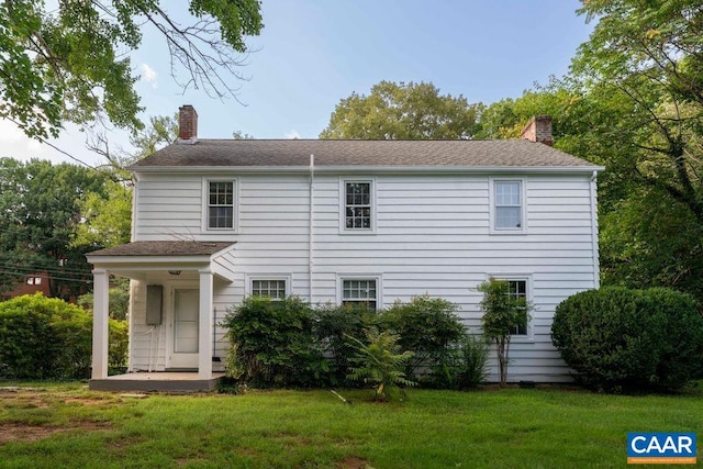 2201 Stadium Rd, Charlottesville, VA 22903 - rear view of property with a chimney and a yard