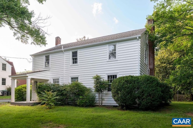 2201 Stadium Rd, Charlottesville, VA 22903 - view of property exterior with a chimney and a lawn