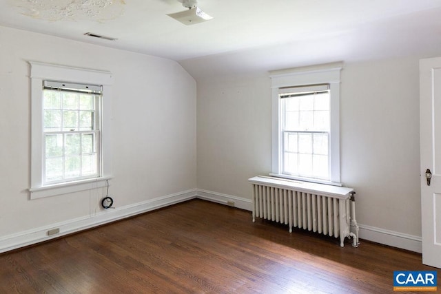 2201 Stadium Rd, Charlottesville, VA 22903 - spare room featuring radiator, wood finished floors, plenty of natural light, and vaulted ceiling