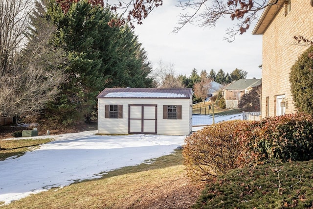 view of snow covered garage