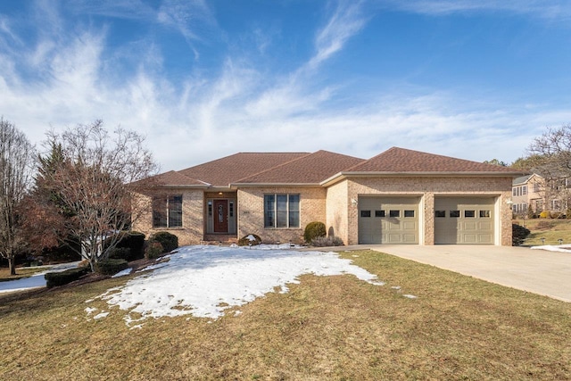 view of front of home featuring a garage and a front lawn