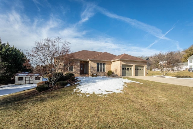 view of front of home featuring a garage and a front yard