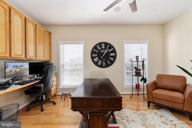 office featuring light wood-style flooring, ceiling fan, baseboards, and recessed lighting