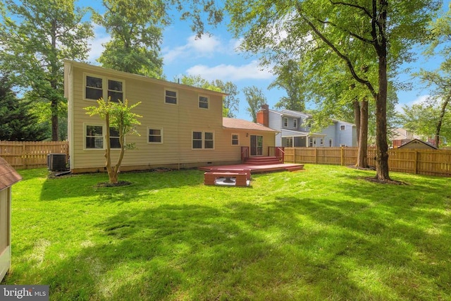 11808 Rutherford Dr, Fredericksburg, VA 22407 - back of property with a fenced backyard, a deck, and a chimney