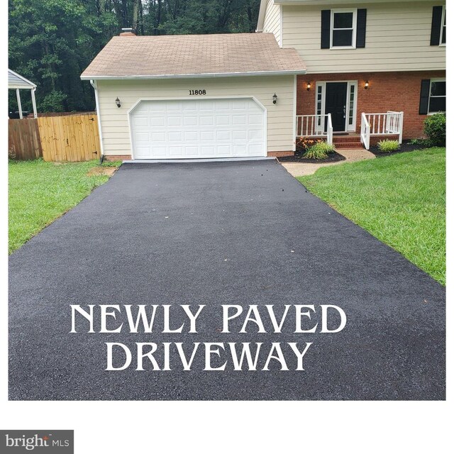 11808 Rutherford Dr, Fredericksburg, VA 22407 - garage with electric panel and a garage door opener
