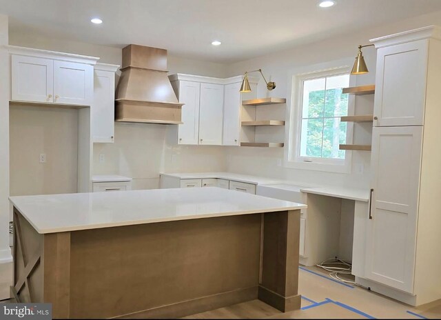 4120 Cabin Rd, Reva, VA 22735 - kitchen with open shelves, premium range hood, a kitchen island, white cabinets, and recessed lighting
