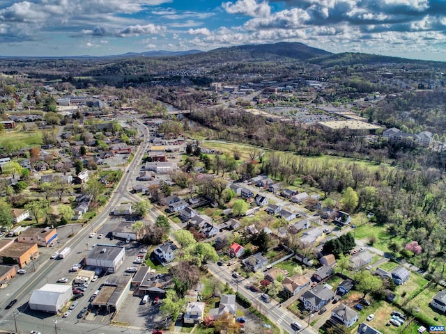 view of property location featuring a mountain backdrop and nearby suburban area