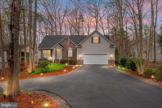 604 Mt Pleasant Dr, Locust Grove, VA 22508 - traditional-style home featuring an attached garage, brick siding, and driveway