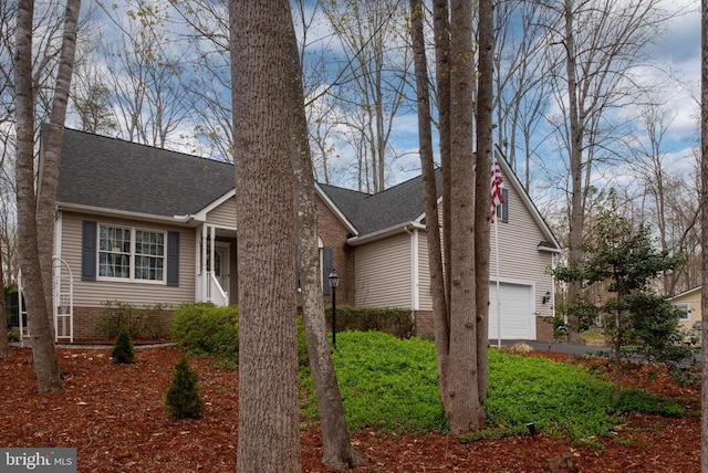 604 Mt Pleasant Dr, Locust Grove, VA 22508 - view of front of house featuring an attached garage, a shingled roof, and brick siding