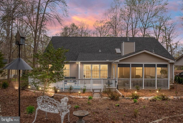 604 Mt Pleasant Dr, Locust Grove, VA 22508 - view of front of house with a sunroom, roof with shingles, and a chimney