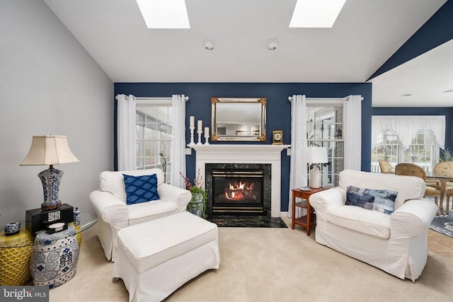 604 Mt Pleasant Dr, Locust Grove, VA 22508 - living area featuring carpet flooring, vaulted ceiling with skylight, and a high end fireplace