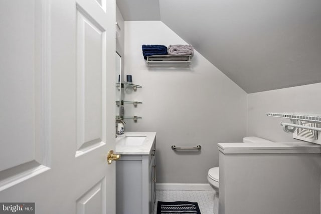 604 Mt Pleasant Dr, Locust Grove, VA 22508 - half bath featuring lofted ceiling, toilet, baseboards, tile patterned flooring, and vanity