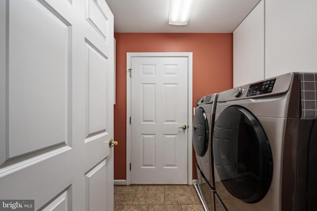 604 Mt Pleasant Dr, Locust Grove, VA 22508 - laundry area with baseboards, washing machine and dryer, and laundry area