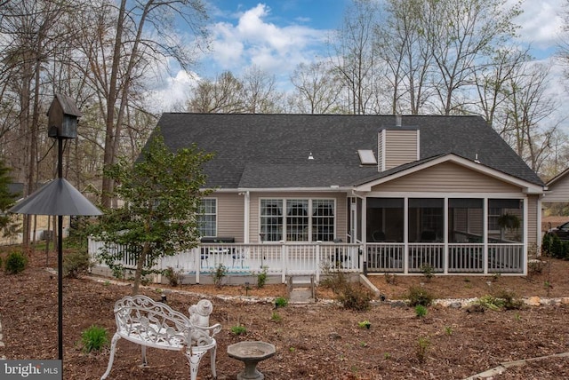 604 Mt Pleasant Dr, Locust Grove, VA 22508 - back of house with a sunroom, roof with shingles, and a chimney