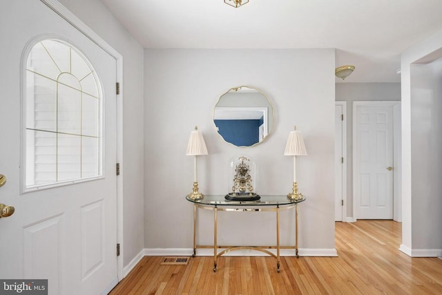 604 Mt Pleasant Dr, Locust Grove, VA 22508 - entrance foyer featuring visible vents, wood finished floors, and baseboards
