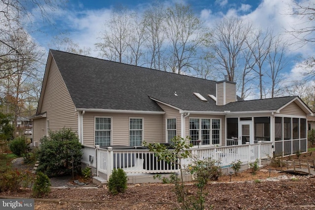604 Mt Pleasant Dr, Locust Grove, VA 22508 - back of property featuring a chimney, a sunroom, and a shingled roof