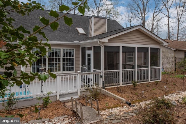 604 Mt Pleasant Dr, Locust Grove, VA 22508 - back of house featuring roof with shingles, a sunroom, and a chimney