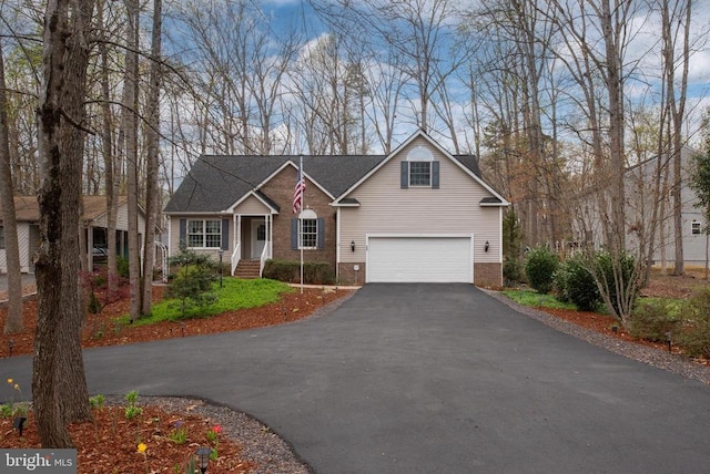 604 Mt Pleasant Dr, Locust Grove, VA 22508 - view of front of home featuring brick siding, a garage, and aphalt driveway