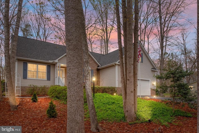 604 Mt Pleasant Dr, Locust Grove, VA 22508 - view of front facade featuring a shingled roof, brick siding, and a garage