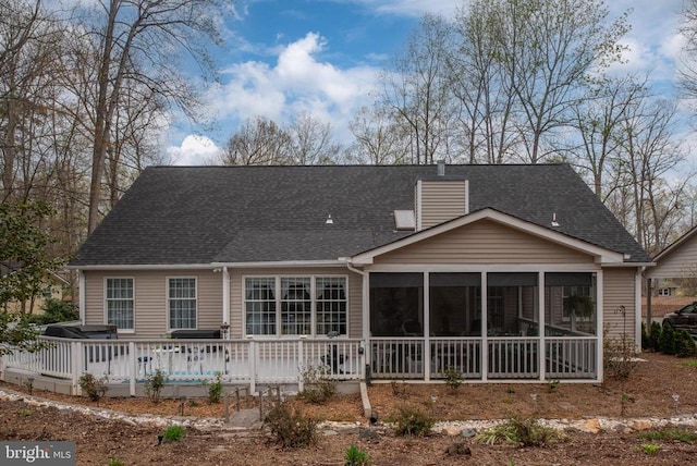 604 Mt Pleasant Dr, Locust Grove, VA 22508 - back of property with a sunroom, roof with shingles, a chimney, and a wooden deck