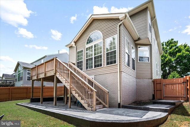 6915 Yeoman Ct, Fredericksburg, VA 22407 - rear view of house with a gate, stairs, a deck, and brick siding