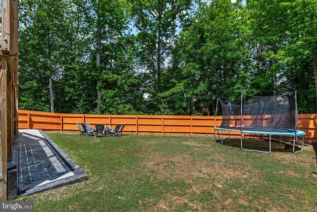 6915 Yeoman Ct, Fredericksburg, VA 22407 - view of yard featuring a trampoline and view of wooded area