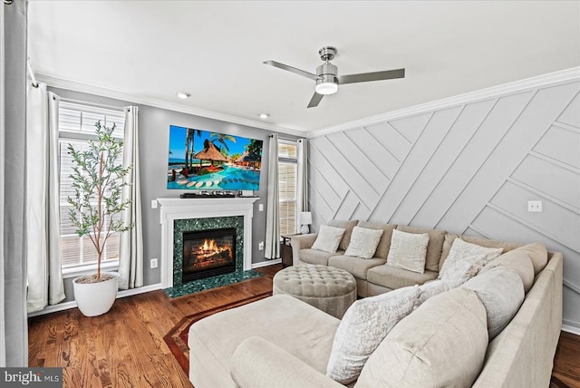 6915 Yeoman Ct, Fredericksburg, VA 22407 - living area featuring crown molding, ceiling fan, wood finished floors, and a premium fireplace