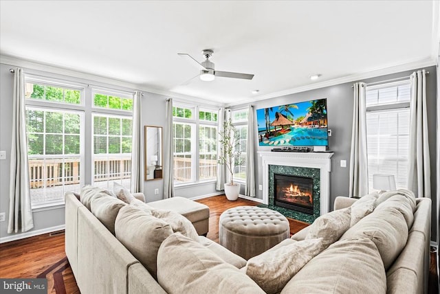 6915 Yeoman Ct, Fredericksburg, VA 22407 - living area featuring crown molding, a ceiling fan, baseboards, plenty of natural light, and a high end fireplace