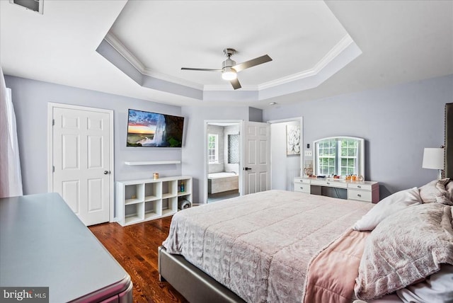 6915 Yeoman Ct, Fredericksburg, VA 22407 - bedroom with a tray ceiling, crown molding, dark wood-style flooring, connected bathroom, and ceiling fan