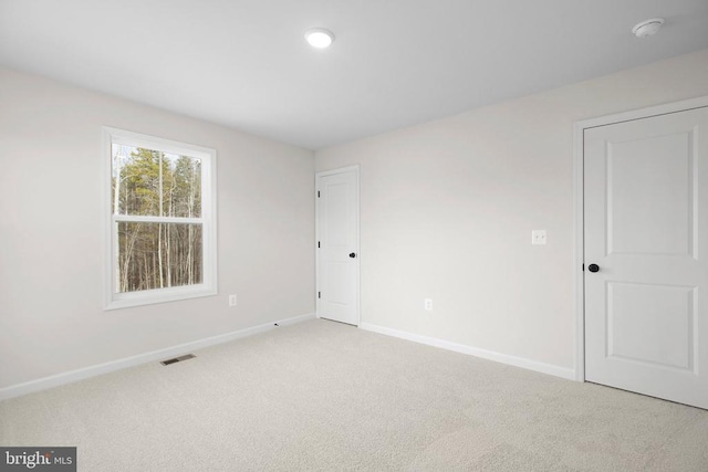 1 Blakely St, Fredericksburg, VA 22408 - unfurnished bedroom with baseboards and light colored carpet