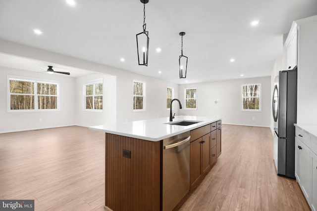 1 Blakely St, Fredericksburg, VA 22408 - kitchen featuring stainless steel appliances, open floor plan, a sink, light wood-type flooring, and recessed lighting