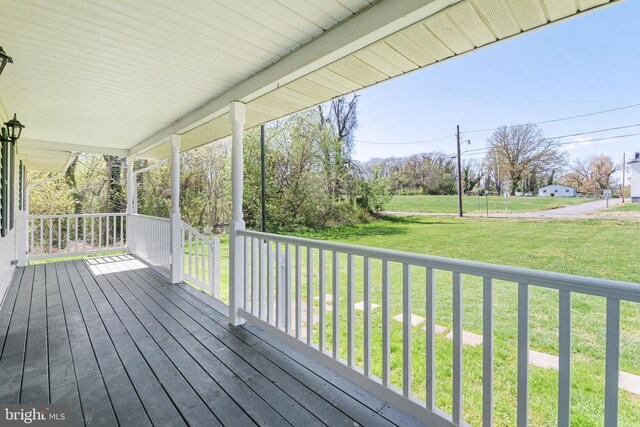 301 Charles St, Gordonsville, VA 22942 - wooden terrace with covered porch and a lawn