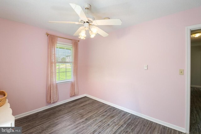 301 Charles St, Gordonsville, VA 22942 - unfurnished room with dark wood-style flooring, ceiling fan, and baseboards