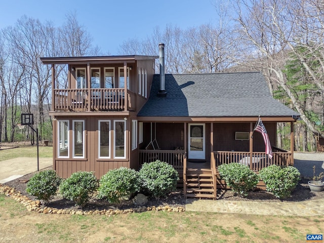 1481 Red Bird Dr, Stanardsville, VA 22973 - rear view of property featuring a shingled roof, covered porch, and a balcony