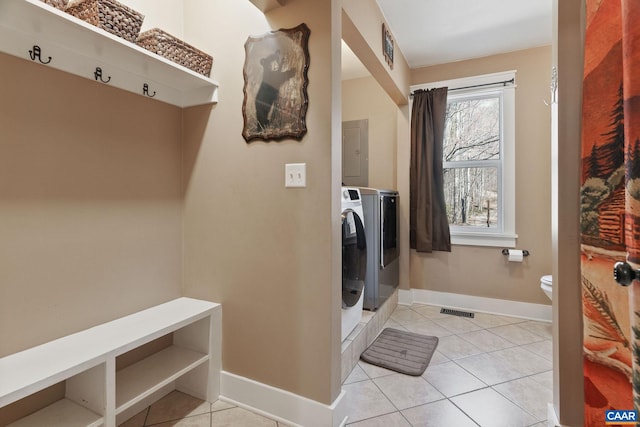 1481 Red Bird Dr, Stanardsville, VA 22973 - washroom featuring washing machine and dryer, baseboards, visible vents, tile patterned floors, and electric panel