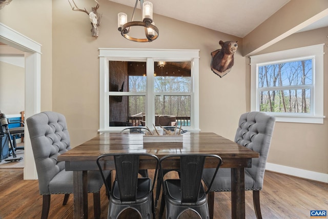 1481 Red Bird Dr, Stanardsville, VA 22973 - dining space with baseboards, a healthy amount of sunlight, a chandelier, and wood finished floors