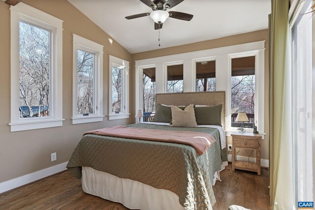 1481 Red Bird Dr, Stanardsville, VA 22973 - bedroom with baseboards, multiple windows, wood finished floors, and vaulted ceiling