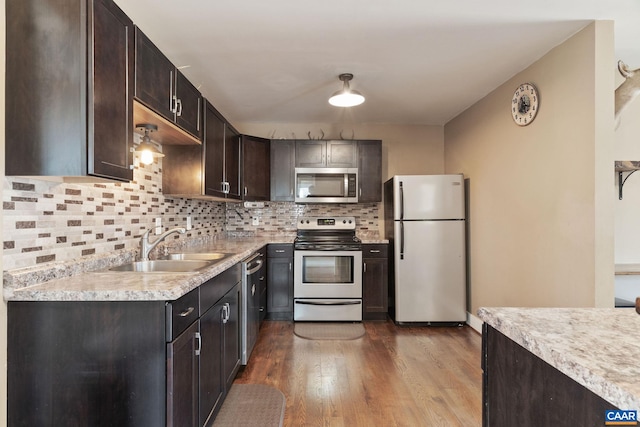 1481 Red Bird Dr, Stanardsville, VA 22973 - kitchen featuring a sink, stainless steel appliances, dark wood-type flooring, backsplash, and light countertops