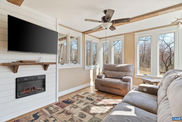 1481 Red Bird Dr, Stanardsville, VA 22973 - living room with a fireplace, ceiling fan, light wood-style flooring, and baseboards