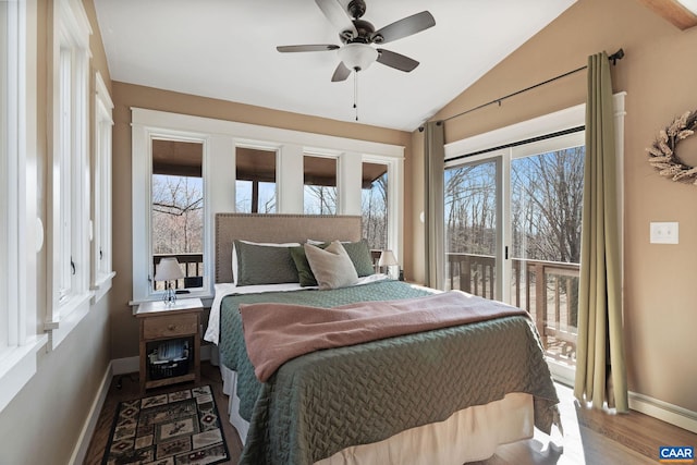 1481 Red Bird Dr, Stanardsville, VA 22973 - bedroom with multiple windows, vaulted ceiling, wood finished floors, and baseboards