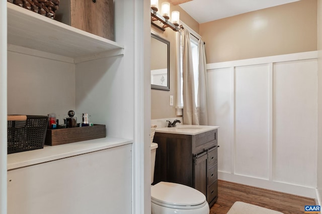 1481 Red Bird Dr, Stanardsville, VA 22973 - bathroom featuring vanity, toilet, and wood finished floors